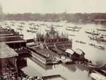 Historical sepia photograph of a royal ceremony with boats on the Chao Phraya River