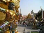 Golden guardian demon statue at the Grand Palace beside the Chao Phraya River